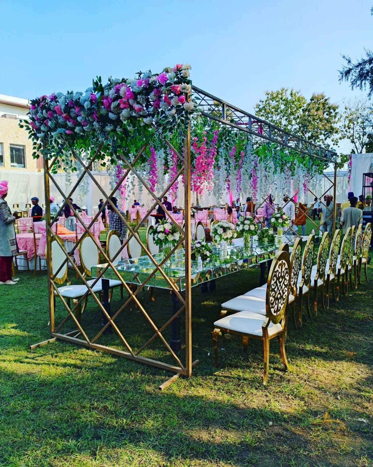 An elegant Whiz Craft outdoor floral décor and table setting