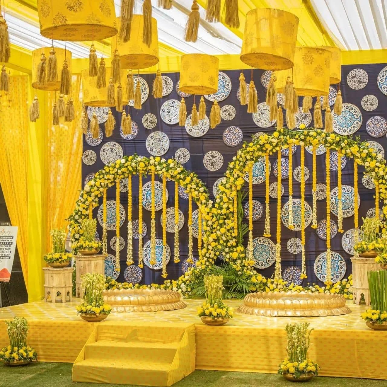 Artistic circular floral and dried-palm backdrop installation